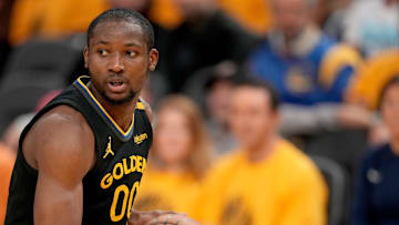 May 12, 2025; San Francisco, California, USA; Golden State Warriors forward Jonathan Kuminga (00) holds onto the ball against the Minnesota Timberwolves in the fourth quarter during game four of the second round for the 2025 NBA Playoffs at Chase Center. Mandatory Credit: Cary Edmondson-Imagn Images