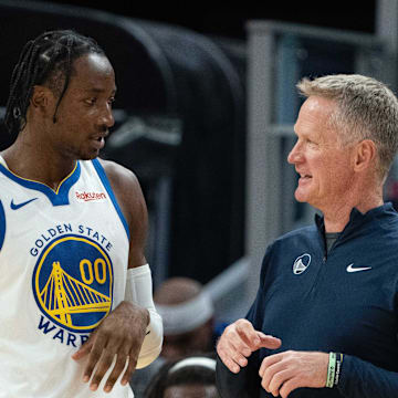 October 20, 2023; San Francisco, California, USA; Golden State Warriors head coach Steve Kerr (right) talks to forward Jonathan Kuminga (00) during the third quarter against the San Antonio Spurs at Chase Center. Mandatory Credit: Kyle Terada-Imagn Images
