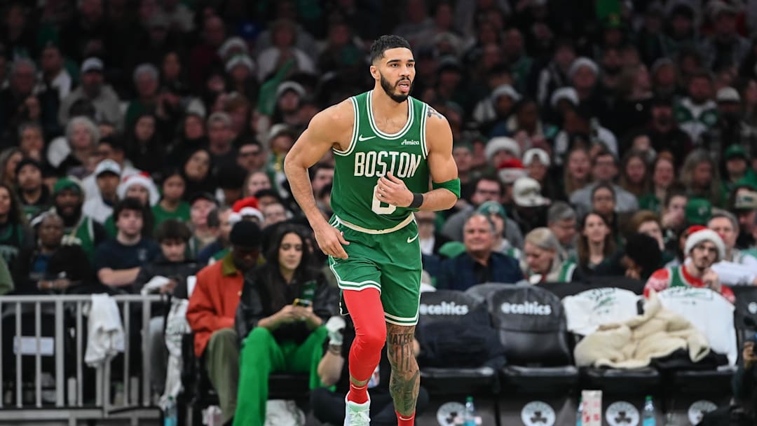 Dec 25, 2024; Boston, Massachusetts, USA; Boston Celtics forward Jayson Tatum (0) runs down the court during the second half against the Philadelphia 76ers at TD Garden. Mandatory Credit: Eric Canha-Imagn Images