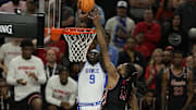 Apr 5, 2025; San Antonio, TX, USA; Duke Blue Devils center Khaman Maluach (9) shoots the ball against Houston Cougars forward J'Wan Roberts (13) during the first half in the semifinals of the men's Final Four of the 2025 NCAA Tournament at Alamodome. Mandatory Credit: Scott Wachter-Imagn Images
