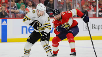 May 6, 2024; Sunrise, Florida, USA; Boston Bruins defenseman Mason Lohrei (6) moves the puck past