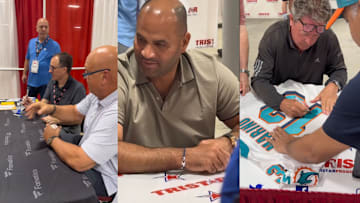 From left to right: Cal Ripken Jr., Albert Pujols, and Dan Marino sign autographs at a previous National Sports Collectors Convention