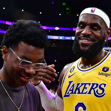 Feb 7, 2023; Los Angeles, California, USA; Los Angeles Lakers forward LeBron James (6) celebrates with his son Bryce Maximus after breaking the all-time scoring record in the third quarter against the Oklahoma City Thunder at Crypto.com Arena. Mandatory Credit: Gary A. Vasquez-Imagn Images