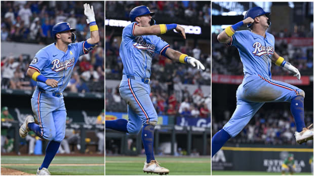 Texas Rangers third baseman Josh Jung waves for his walk-off home run over the right-field fence on Sunday.