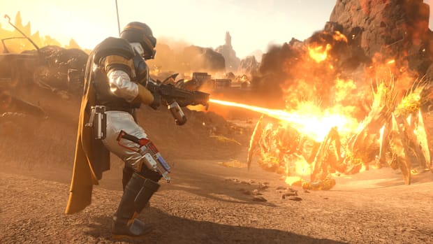 Helldivers 2 screenshot of a Helldiver burning bugs with a flamethrower.