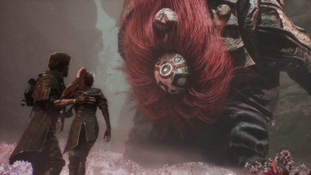 Clair Obscur: Expedition 33 screenshot. Man and woman face-to-face with a giantred-haired monster wearing a white mask