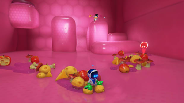 Astro atop some apples in a pink level from the game.