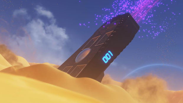 A PS5-shaped spaceship crashed in the sand at the Crash Site area in Astro Bot.