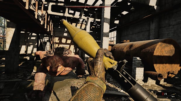 Stalker 2 screenshot of loading an RPG while a big hairy monster charges at you.