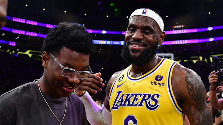 Feb 7, 2023; Los Angeles, California, USA; Los Angeles Lakers forward LeBron James (6) celebrates with his son Bryce Maximus after breaking the all-time scoring record in the third quarter against the Oklahoma City Thunder at Crypto.com Arena. Mandatory Credit: Gary A. Vasquez-Imagn Images