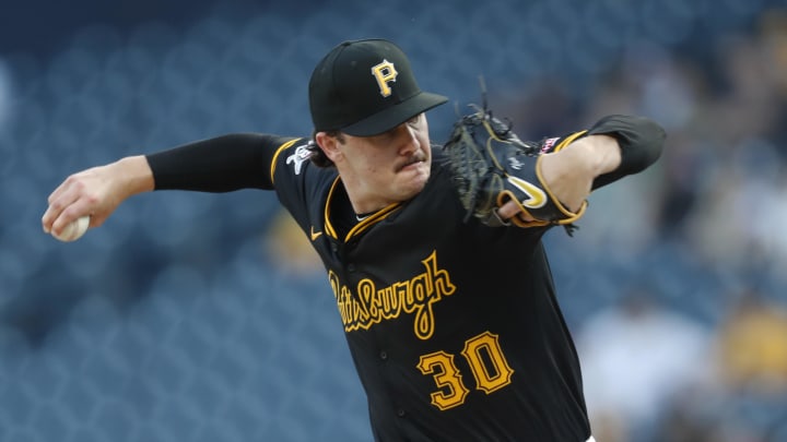 Aug 22, 2024; Pittsburgh, Pennsylvania, USA;  Pittsburgh Pirates starting pitcher Paul Skenes (30) delivers a pitch against the Cincinnati Reds during the first inning at PNC Park. Mandatory Credit: Charles LeClaire-USA TODAY Sports