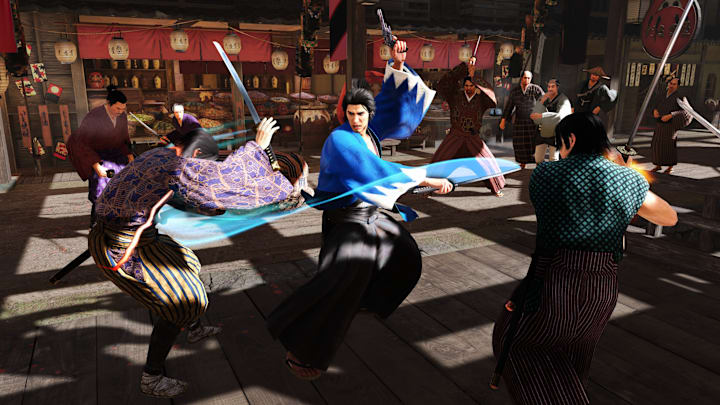 A man in a  blue robe swirling his blade around him, hitting multiple men weilding swords.