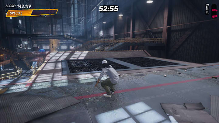 A player about to jump off a ramp onto an overhead catwalk in the Foundry level of Tony Hawk's Pro Skater 3+4