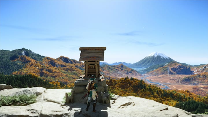 Atsu bowing at a Shrine in Ghost of Yotei.