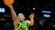 Mar 23, 2025; Seattle, WA, USA; Oregon Ducks guard Keeshawn Barthelemy (9) drives to the basket against Arizona Wildcats guard Anthony Dell'Orso (3) in the second half at Climate Pledge Arena. Mandatory Credit: Stephen Brashear-Imagn Images