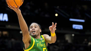 Mar 23, 2025; Seattle, WA, USA; Oregon Ducks guard Keeshawn Barthelemy (9) drives to the basket against Arizona Wildcats guard Anthony Dell'Orso (3) in the second half at Climate Pledge Arena. Mandatory Credit: Stephen Brashear-Imagn Images