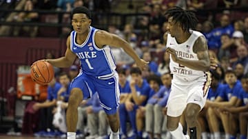 Feb 17, 2024; Tallahassee, Florida, USA; Duke basketball guard Caleb Foster (1) drives to the net as Florida State Seminoles forward Jamir Watkins (2) defends during the second half at Donald L. Tucker Center