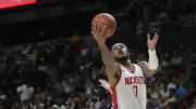 Jul 12, 2024; Las Vegas, NV, USA;  Houston Rockets forward Cam Whitmore (7) attempts to score a layup against Los Angeles Lakers forward Dalton Knecht (4) during the first half at the Thomas & Mack Center. Mandatory Credit: Lucas Peltier-USA TODAY Sports