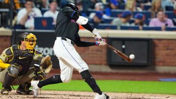 Jun 14, 2024; New York City, New York, USA; New York Mets left fielder Brandon Nimmo (9) hits a single against the San Diego Padres during the third inning at Citi Field. 