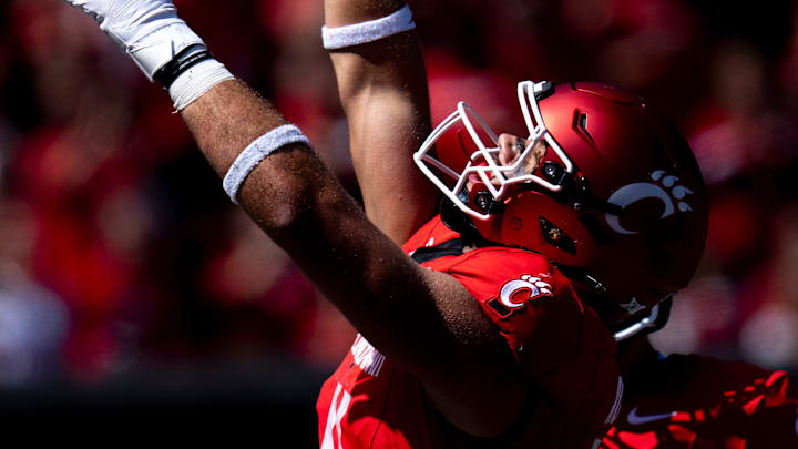 Cincinnati Bearcats tight end Joe Royer (11) gestures after scoring a touchdown in the third quarter of the College Football game between the Cincinnati Bearcats and the Pittsburgh Panthers at Nippert Stadium in Cincinnati on Saturday, Sept. 7, 2024.