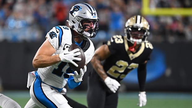 Carolina Panthers wide receiver Adam Thielen (19) makes a catch in front of New Orleans Saints cornerback Marshon Lattimore 