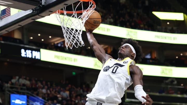 Apr 2, 2024; Salt Lake City, Utah, USA; Utah Jazz forward Taylor Hendricks (0) dunks the ball against the Cleveland Cavaliers during the fourth quarter at Delta Center. Mandatory Credit: Rob Gray-USA TODAY Sports