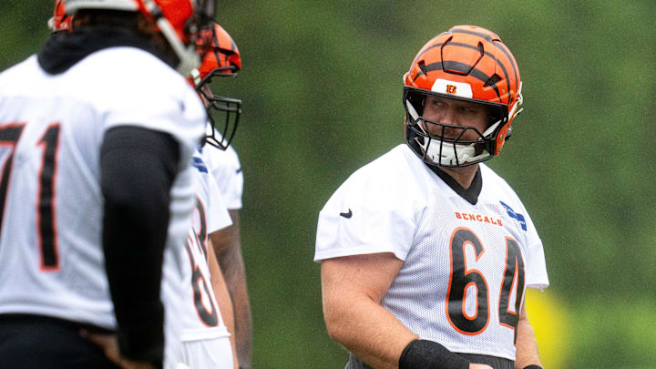 Cincinnati Bengals center Ted Karras (64) prepares to snap the ball during the Cincinnati Bengals practice in Cincinnati on Tuesday, May 27, 2025. Cincinnati Bengals center Ted Karras (64) prepares to snap the ball during the Cincinnati Bengals practice in Cincinnati on Tuesday, May 27, 2025.