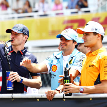 Max Verstappen of the Netherlands and Oracle Red Bull Racing, Carlos Sainz of Spain and Ferrari and Lando Norris of Great Britain and McLaren wave to the crowd on the drivers parade prior to the F1 Grand Prix of Miami at Miami International Autodrome on May 05, 2024 in Miami, Florida. 