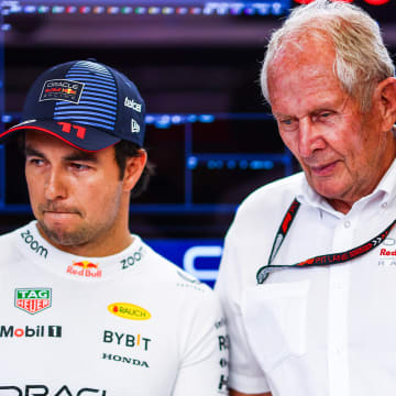 Sergio Perez of Mexico and Oracle Red Bull Racing and Oracle Red Bull Racing Team Consultant Dr Helmut Marko look on in the garage prior to Sprint Qualifying ahead of the F1 Grand Prix of Austria at Red Bull Ring on June 28, 2024 in Spielberg, Austria. 