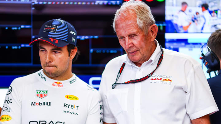 Sergio Perez of Mexico and Oracle Red Bull Racing and Oracle Red Bull Racing Team Consultant Dr Helmut Marko look on in the garage prior to Sprint Qualifying ahead of the F1 Grand Prix of Austria at Red Bull Ring on June 28, 2024 in Spielberg, Austria. 