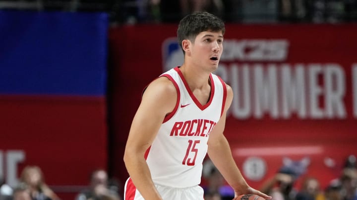 Jul 12, 2024; Las Vegas, NV, USA; Houston Rockets guard Reed Sheppard (15) dribbles the ball against the Los Angeles Lakers during the first half at Thomas & Mack Center. Mandatory Credit: Lucas Peltier-USA TODAY Sports