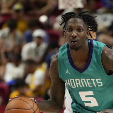 Jul 14, 2025; Las Vegas, NV, USA; Charlotte Hornets guard Damion Baugh (5) dribbles the ball against the Dallas Mavericks during the second half of a NBA basketball game at the Thomas & Mack Center. Mandatory Credit: Lucas Peltier-Imagn Images