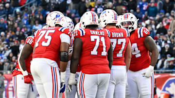 Dec 1, 2024; Foxborough, Massachusetts, USA; The New England Patriots offense huddles during the second half against the Indianapolis Colts at Gillette Stadium. Mandatory Credit: Eric Canha-Imagn Images