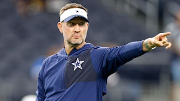 Aug 22, 2025; Arlington, Texas, USA; Dallas Cowboys head coach Brian Schottenheimer gives directions prior to the game against the Atlanta Falcons at AT&T Stadium. Mandatory Credit: Andrew Dieb-Imagn Images