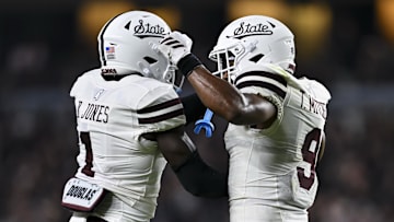 Mississippi State Bulldogs cornerback Kelley Jones (1) and safety Tony Mitchell (9) celebrate a stop on fourth and one in the second quarter against the Texas A&M Aggies at Kyle Field.
