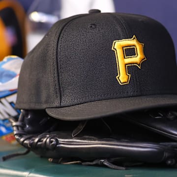Sep 8, 2023; Atlanta, Georgia, USA; A detailed view of a Pittsburgh Pirates hat and glove before a game against the Pittsburgh Pirates in the first inning at Truist Park.