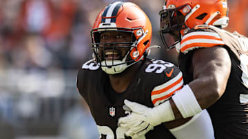 Nov 5, 2023; Cleveland, Ohio, USA; Cleveland Browns defensive tackle Shelby Harris (93) celebrates his tackle for loss as defensive tackle Maurice Hurst II (90) congratulates him against the Arizona Cardinals during the first quarter at Cleveland Browns Stadium. Mandatory Credit: Scott Galvin-Imagn Images