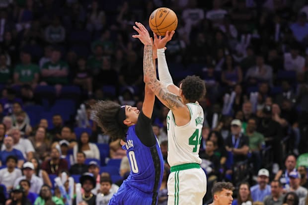 Boston Celtics forward Miles Norris (44) shoots against Orlando Magic guard Anthony Black (0)