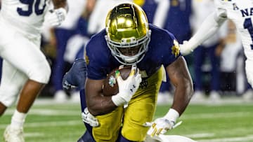 Nov 8, 2025; South Bend, Indiana, USA; Notre Dame Fighting Irish running back Jeremiyah Love (4) runs the ball.
