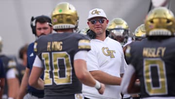 Sep 20, 2025; Atlanta, Georgia, USA; Georgia Tech Yellow Jackets head coach Brent Key celebrates with quarterback Haynes King (10) after a touchdown pass against the Temple Owls in the first quarter at Bobby Dodd Stadium at Hyundai Field. Mandatory Credit: Brett Davis-Imagn Images