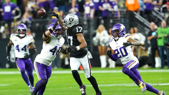 Dec 10, 2023; Paradise, Nevada, USA; Las Vegas Raiders wide receiver Davante Adams (17) laterals the ball over Minnesota Vikings linebacker Ivan Pace Jr. (40) during the final seconds of the fourth quarter at Allegiant Stadium. Mandatory Credit: Stephen R. Sylvanie-USA TODAY Sports