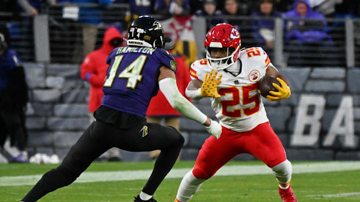 Jan 28, 2024; Baltimore, Maryland, USA; Kansas City Chiefs running back Clyde Edwards-Helaire (25) runs with the ball against Baltimore Ravens safety Kyle Hamilton (14) during the second half in the AFC Championship football game at M&T Bank Stadium. Mandatory Credit: Tommy Gilligan-Imagn Images Jan 28, 2024; Baltimore, Maryland, USA; Kansas City Chiefs running back Clyde Edwards-Helaire (25) runs with the ball against Baltimore Ravens safety Kyle Hamilton (14) during the second half in the AFC Championship football game at M&T Bank Stadium. Mandatory Credit: Tommy Gilligan-Imagn Images