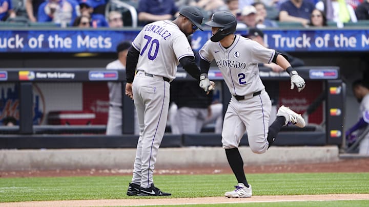 Jun 1, 2025; New York City, New York, USA; Colorado Rockies third base coach Andy Gonzalez (70) congratulates Colorado Rockies right fielder Tyler Freeman (2) for hitting a home run against the New York Mets during the fifth inning at Citi Field.