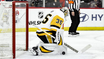 Apr 11, 2025; Newark, New Jersey, USA; Pittsburgh Penguins goaltender Tristan Jarry (35) makes a save against the New Jersey Devils during the second period at Prudential Center. Mandatory Credit: John Jones-Imagn Images