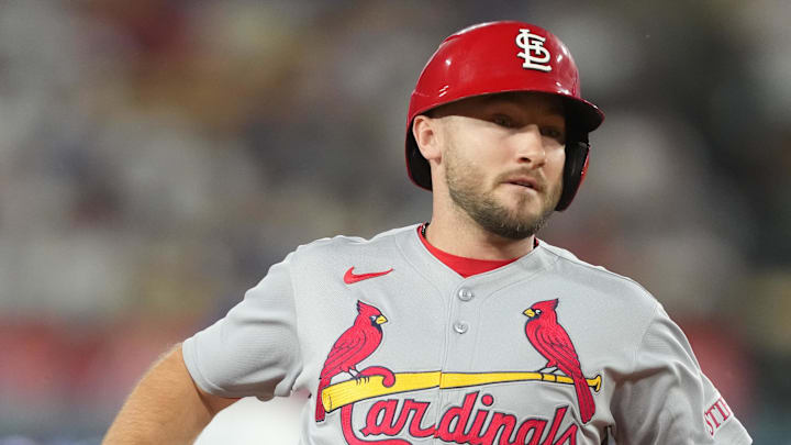 Aug 4, 2025; Los Angeles, California, USA; St. Louis Cardinals second base Garrett Hampson (13) who pinch ran for first base Willson Contreras (40) advances to third base on a single by right fielder Lars Nootbaar (21) in the top of the ninth inning during an MLB game against the Los Angeles Dodgers at Dodger Stadium. Mandatory Credit: Kirby Lee-Imagn Images