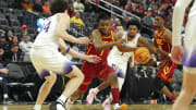 Mar 13, 2024; Las Vegas, NV, USA; USC Trojans guard Isaiah Collier (1) dribbles between Washington Huskies center Braxton Meah (34) and forward Keion Brooks Jr. (1) during the second half at T-Mobile Arena. Mandatory Credit: Stephen R. Sylvanie-USA TODAY Sports