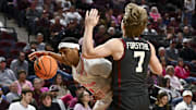 Jan 28, 2025; College Station, Texas, USA; Texas A&M Aggies guard Zhuric Phelps (1) drives as Oklahoma Sooners guard Dayton Forsythe (7) defends during the first half at Reed Arena. Mandatory Credit: Maria Lysaker-Imagn Images 