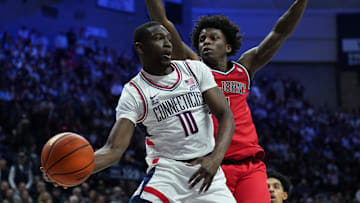Feb 7, 2025; Storrs, Connecticut, USA; UConn Huskies guard Hassan Diarra (10) passes the ball against St. John's Red Storm guard Kadary Richmond (1) in the first half at Harry A. Gampel Pavilion. Mandatory Credit: David Butler II-Imagn Images