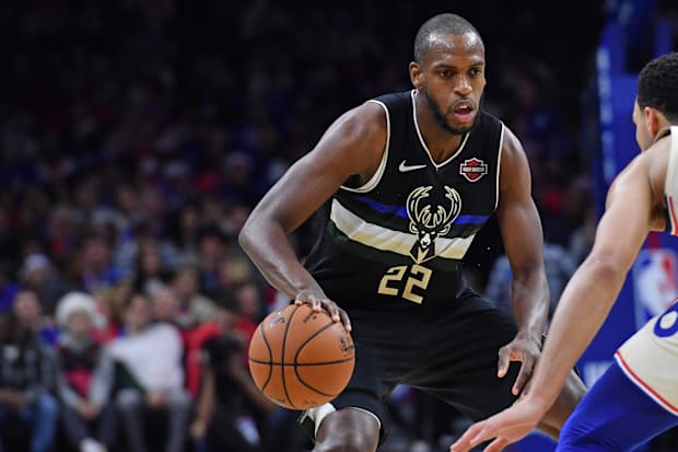 Milwaukee Bucks forward Khris Middleton (22) dribbles against the Philadelphia 76ers at Wells Fargo Center in 2023-24.