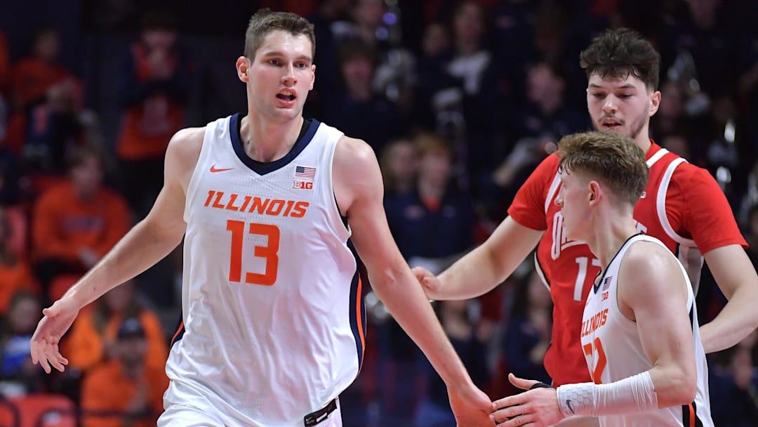 Feb 2, 2025; Champaign, Illinois, USA; Illinois Fighting Illini center Tomislav Ivisic (13) gets a hand from teammate Kasparas Jakucionis (32) during the second half at State Farm Center. Mandatory Credit: Ron Johnson-Imagn Images